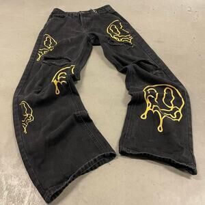 Others Follow Black Jeans with Yellow Graphic Drip Design
